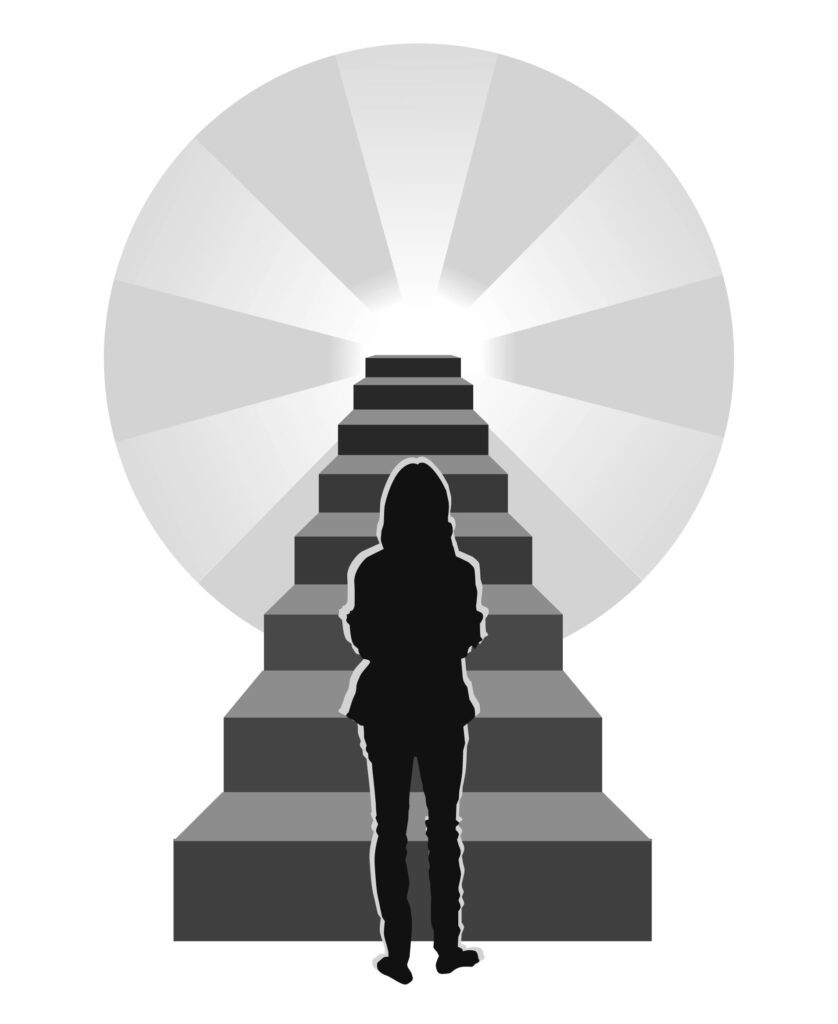 A woman standing on top of steps in front of the light.