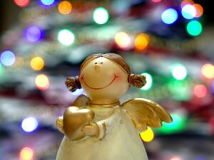 A close up of a figurine with lights in the background