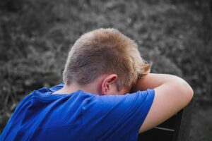 A man with his head down on the ground