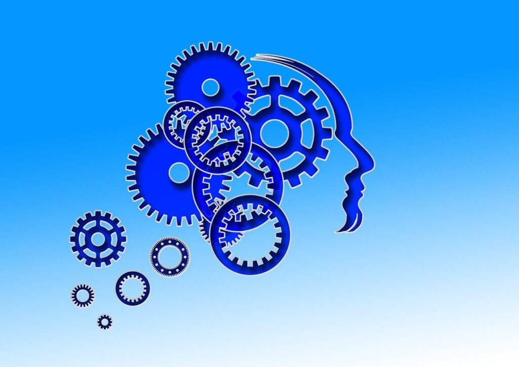 A blue background with gears and a person 's head